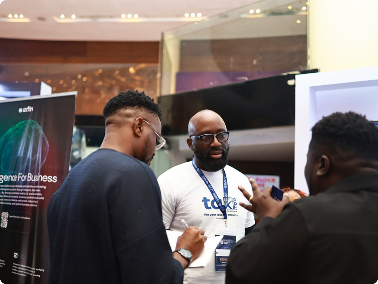 David Salami engaging with attendees at technology summit